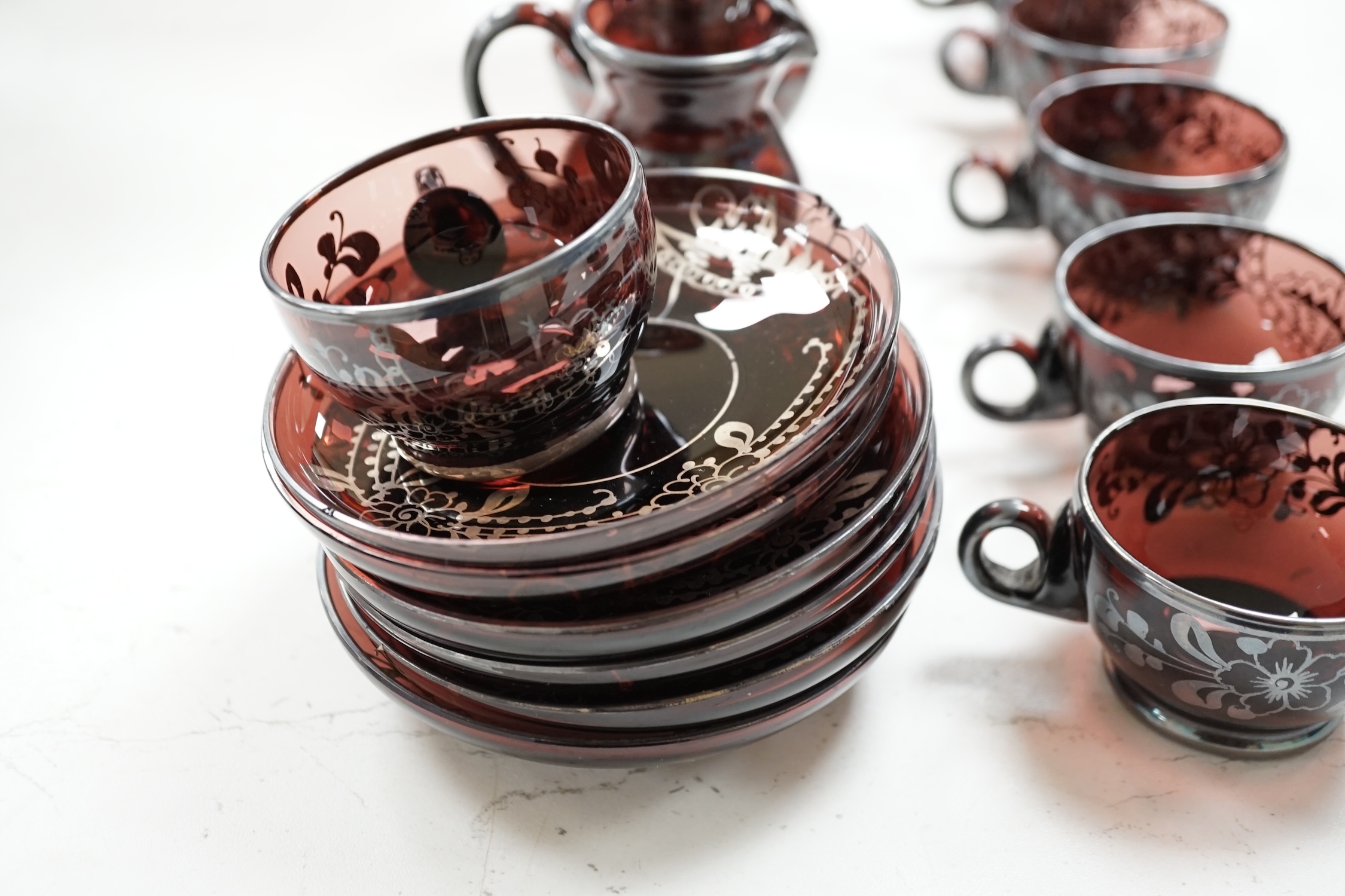 A Venetian amethyst glass tea set. Condition - some damage